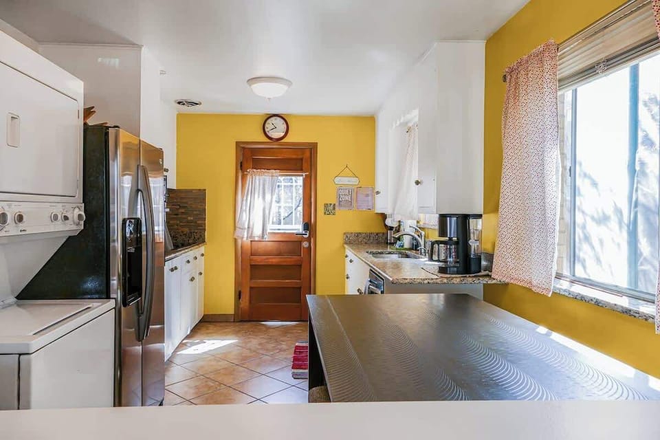 The kitchen features a modern design with high-quality appliances, ample counter space, and all the essentials needed for effortless meal preparation.