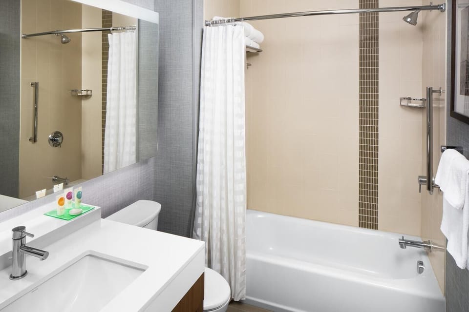 Refresh easily in the bright bath with tub-shower combo.