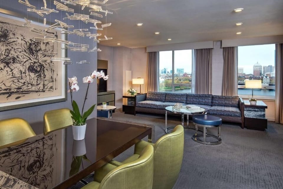 Gather in the spacious lounge beneath statement lighting and views.