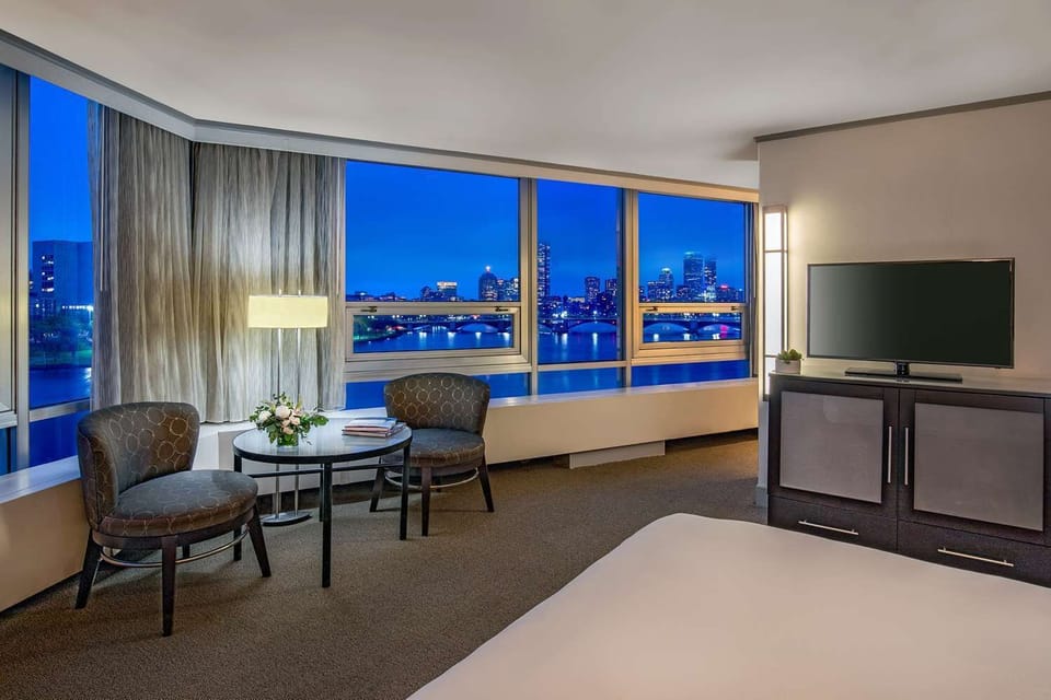 Unwind at dusk as city lights shimmer outside.