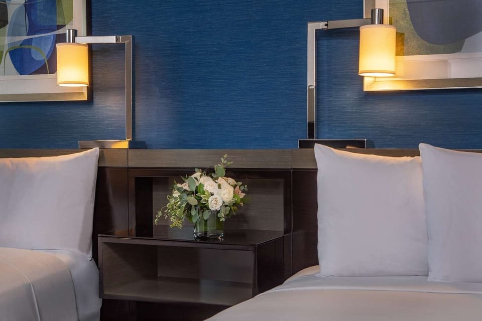 Savor cozy bedside lighting and crisp, hotel-fresh linens.