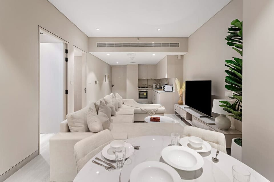 Living Room: Stylish open space with modern decor, perfect for unwinding after city adventures!