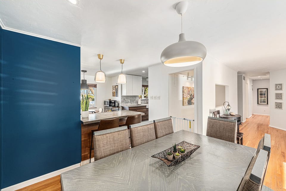 Spacious dining area seamlessly opens to the kitchen, creating the perfect space for meals and entertaining.