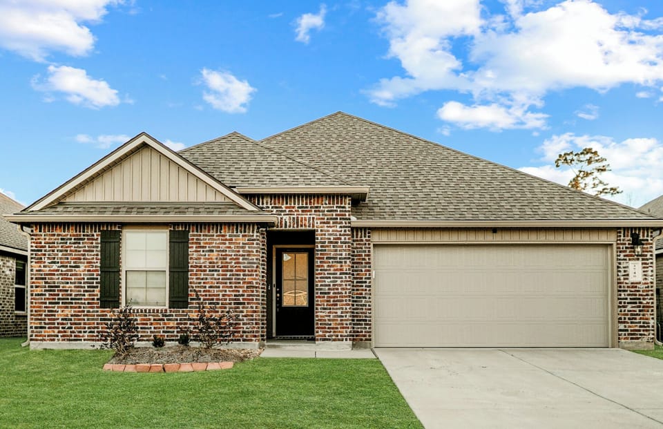 An exterior view of your next stay in an expertly maintained property, built after 2020. The home is two miles from a newly developed golf course. 