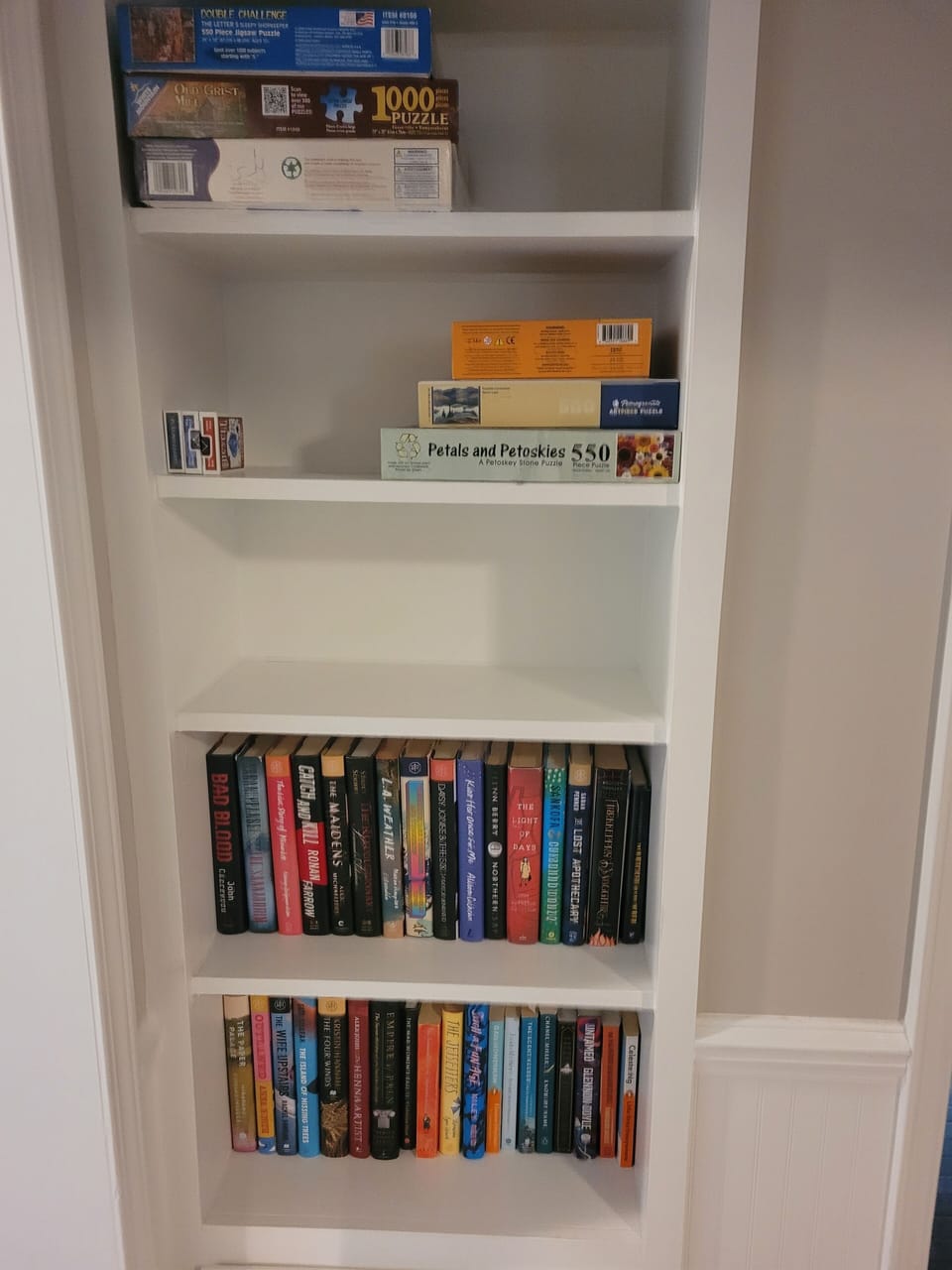 LIVING ROOM:  There is a good collection of books, games, and puzzles on a shelf in the living room.