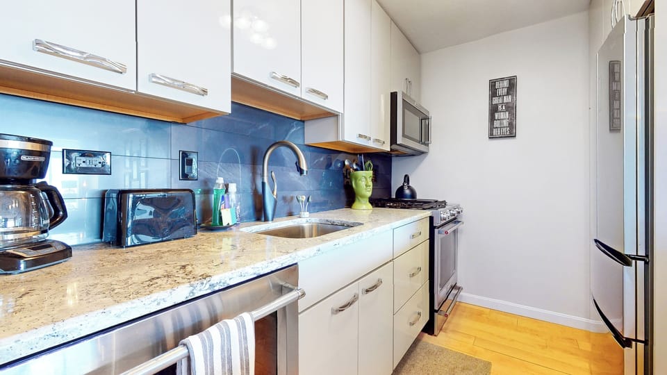Granite countertops, Coffee maker, stove, fridge, and microwave