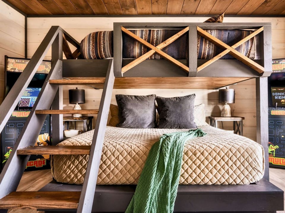 A unique bunk bed design with a king-size lower bed.