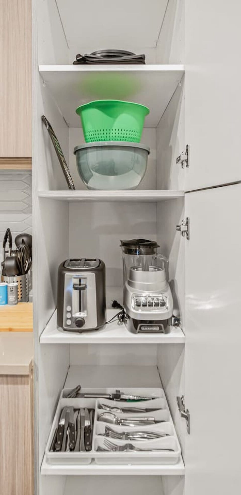 As you open the kitchen, you discover an assortment of coffee pods, and sugar, ensuring you have everything you need for a perfect morning or afternoon pick-me-up.