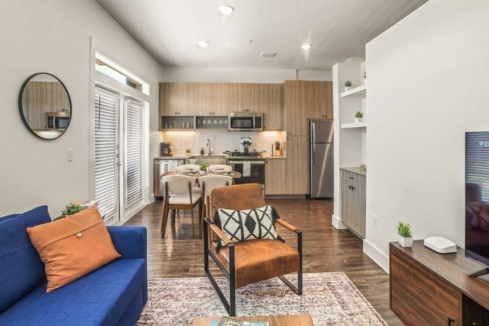 You are surrounded by tasteful decor and warm tones, making the living room a perfect setting for any occasion.