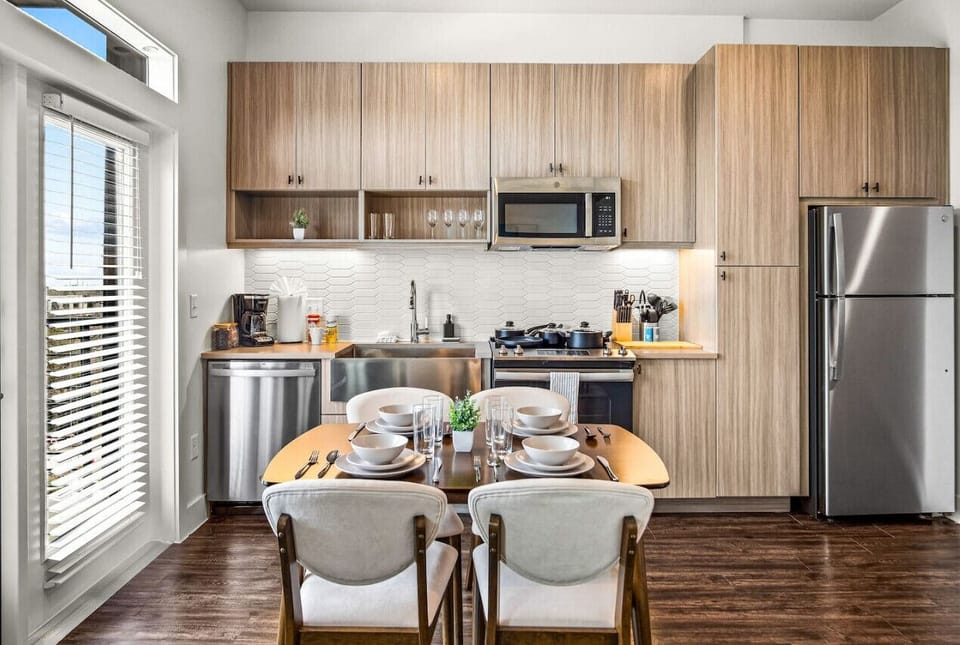 The dining room is bathed in natural light, creating a bright and inviting space where every meal feels special.
