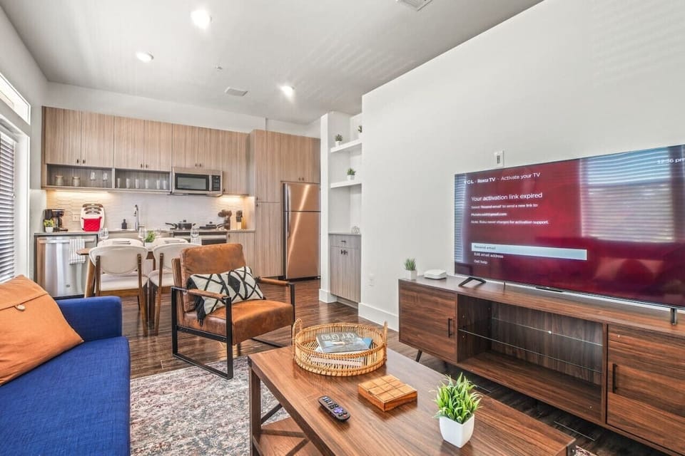 The living room is filled with natural light, creating a bright and welcoming space that invites relaxation.