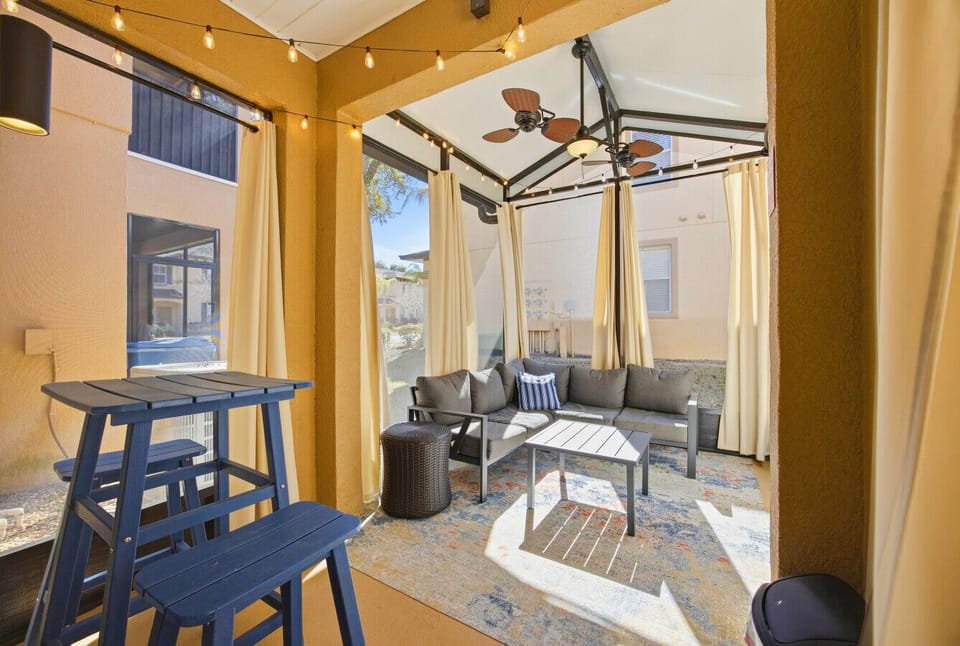 Enjoy the shaded patio space—perfect for relaxing or casual outdoor dining.