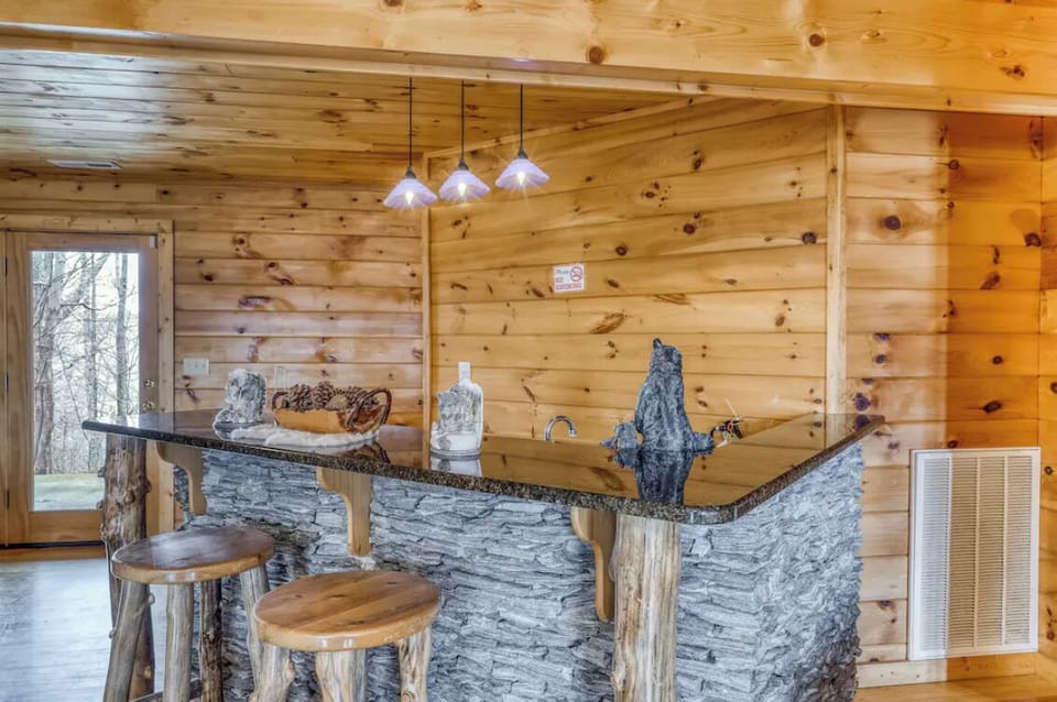 Pour your favorite drink, or pull up a stool at the custom bar while watching your family play games all night long.