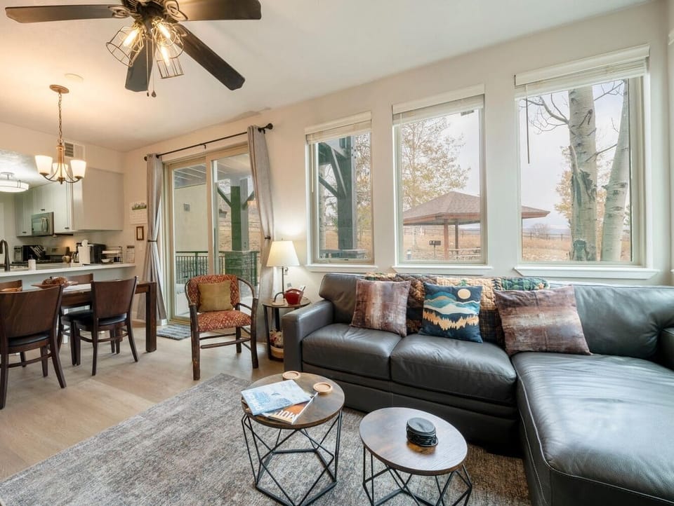Sunny and spacious living area with lots of natural light. Queen-size sofa bed.