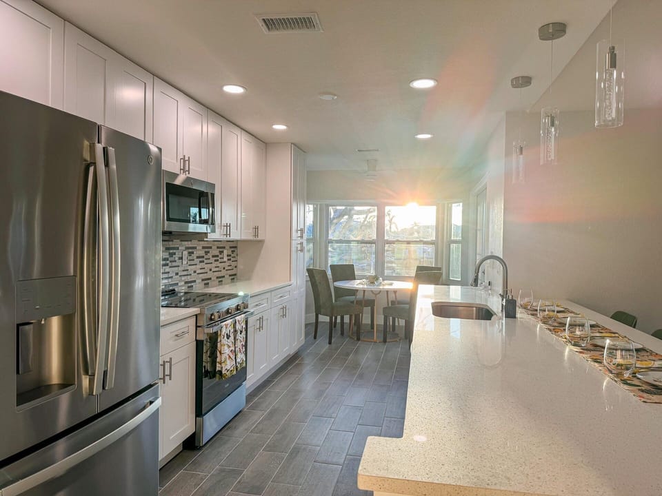 Bright, open, fully-equipped kitchen. Kitchen table seats 4 with the kitchen island seating an additional 4