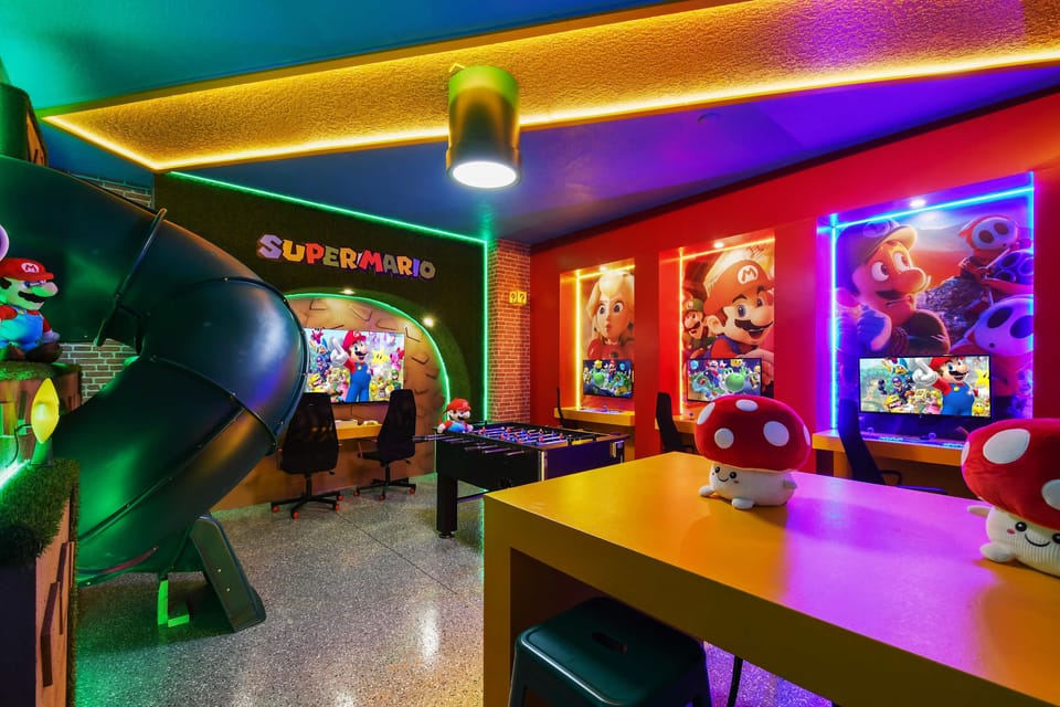 Vibrant Super Mario game room with slides, arcade, and fun vibes!
