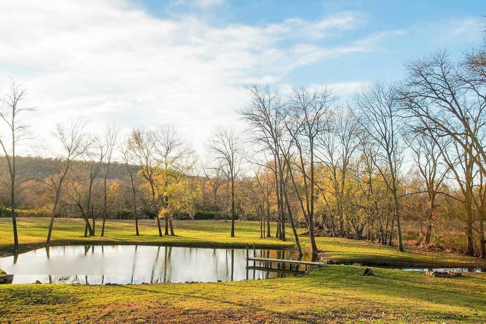 Enjoy serene views of the private pond and peaceful countryside—an idyllic spot for relaxing or a leisurely stroll.