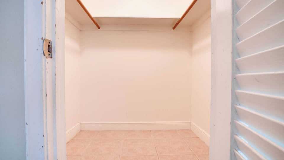 Spacious closet ready to accommodate your wardrobe with ease and style.
