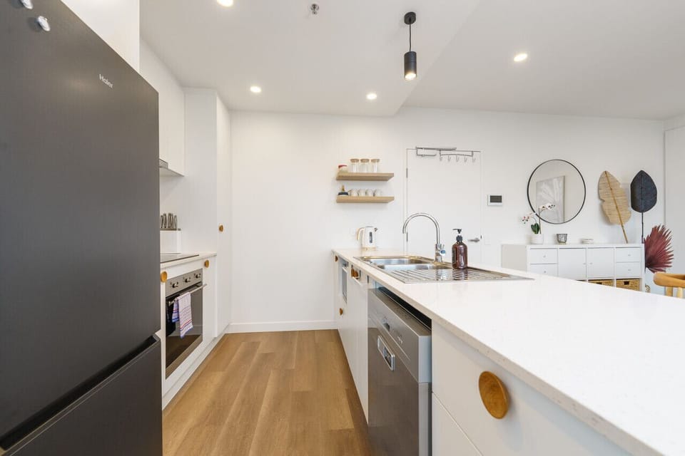 Cook with ease in the sleek and fully equipped kitchen, complete with modern appliances, ample bench space, and all the essentials for preparing your favourite meals.