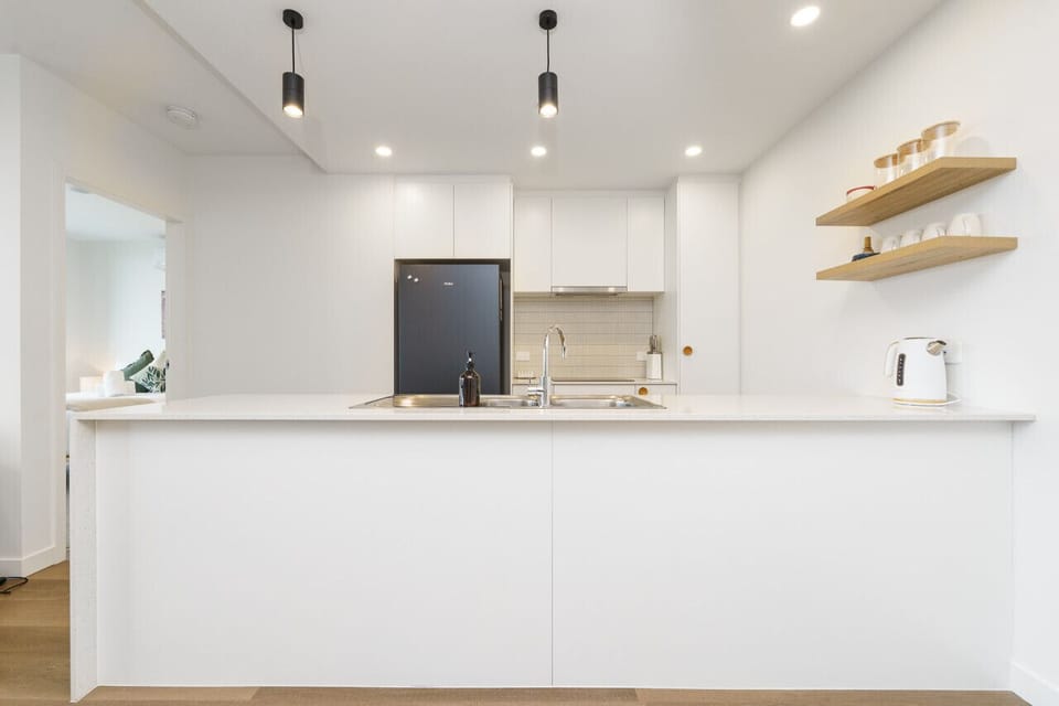 Cook with ease in the sleek and fully equipped kitchen, complete with modern appliances, ample bench space, and all the essentials for preparing your favourite meals.