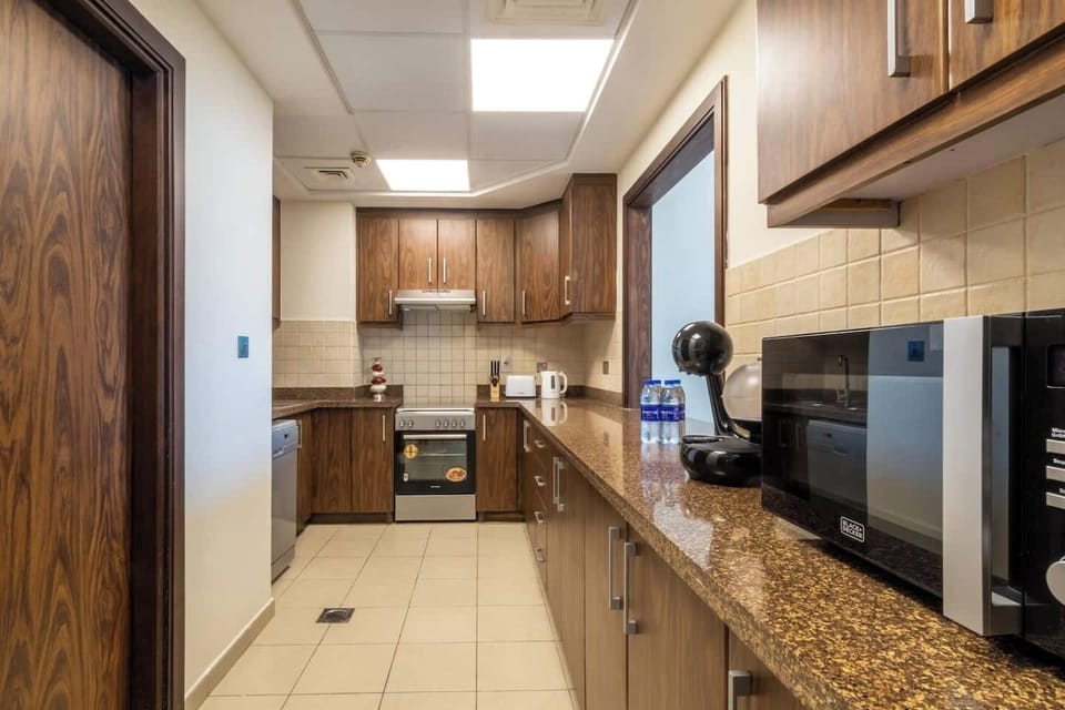 A stylish well-stocked kitchen with all the modern appliances you might need. The kitchen comes with an oven, a dishwasher, a stove, a microwave, a fridge, tea &coffee maker, etc. We have everything for your carefree stay.