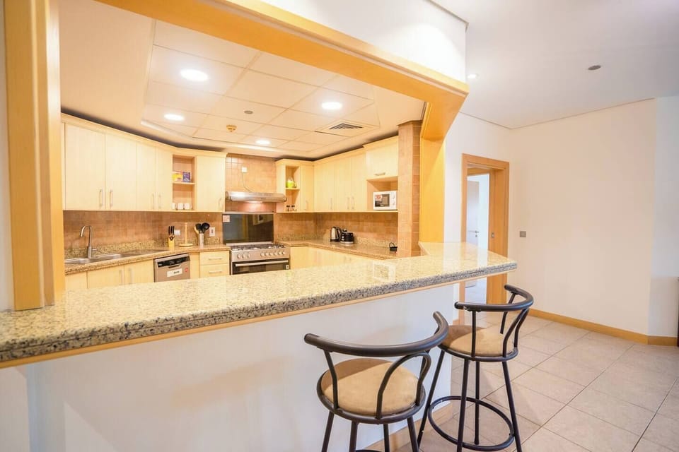 The kitchen features a counter and 2 bar stools for you to enjoy a morning coffee!