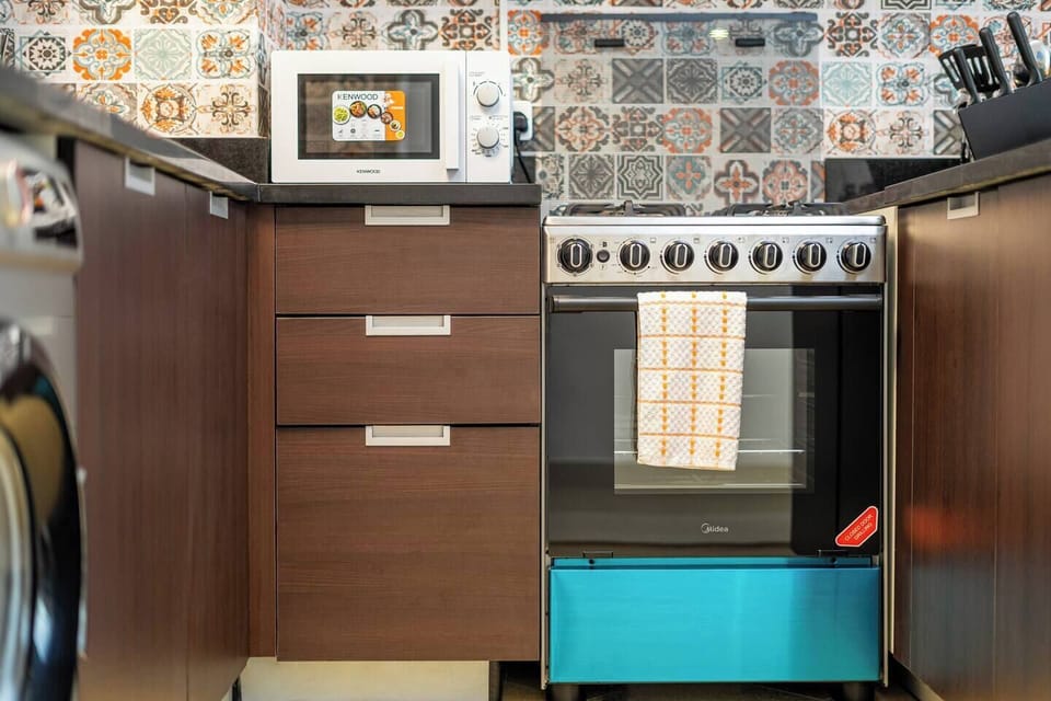 Microwave oven and cooking range to heat up your takeaway or leftover meals.