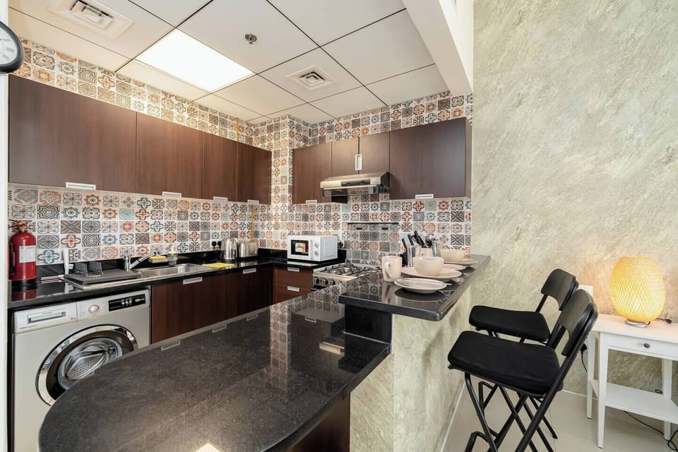 Enjoy this kitchen countertop that doubles as a dining area, perfect for couples or solo travelers.
