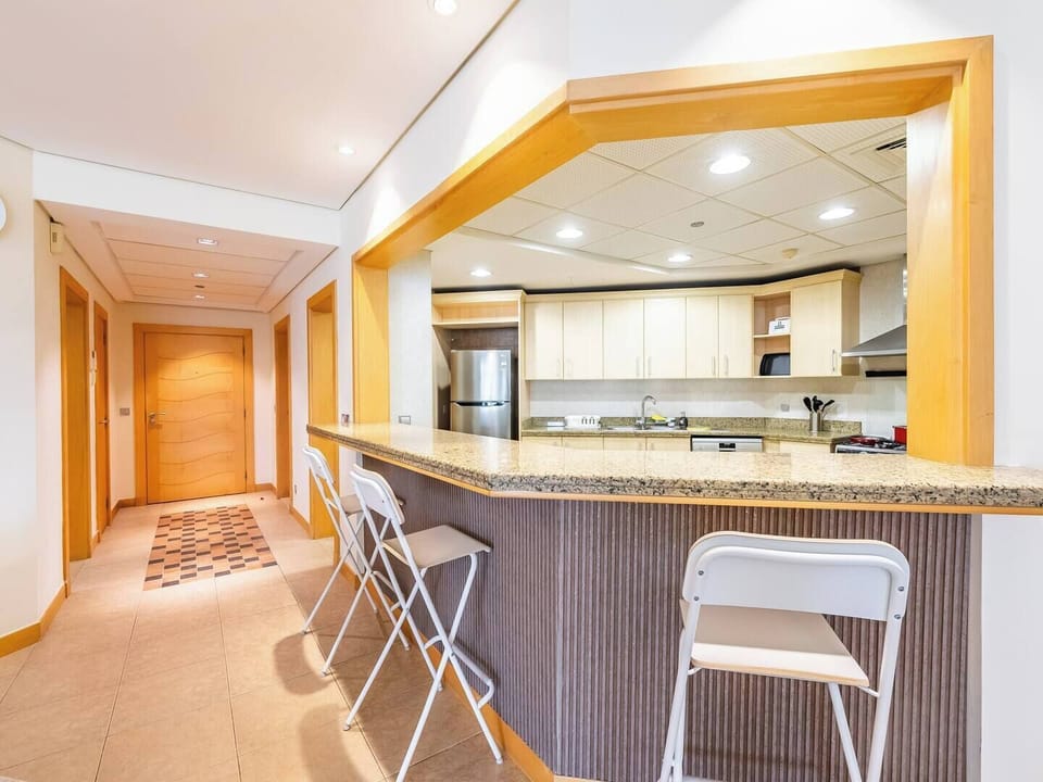 A bar-style area integrated into the kitchen, perfect for casual and convenient dining.