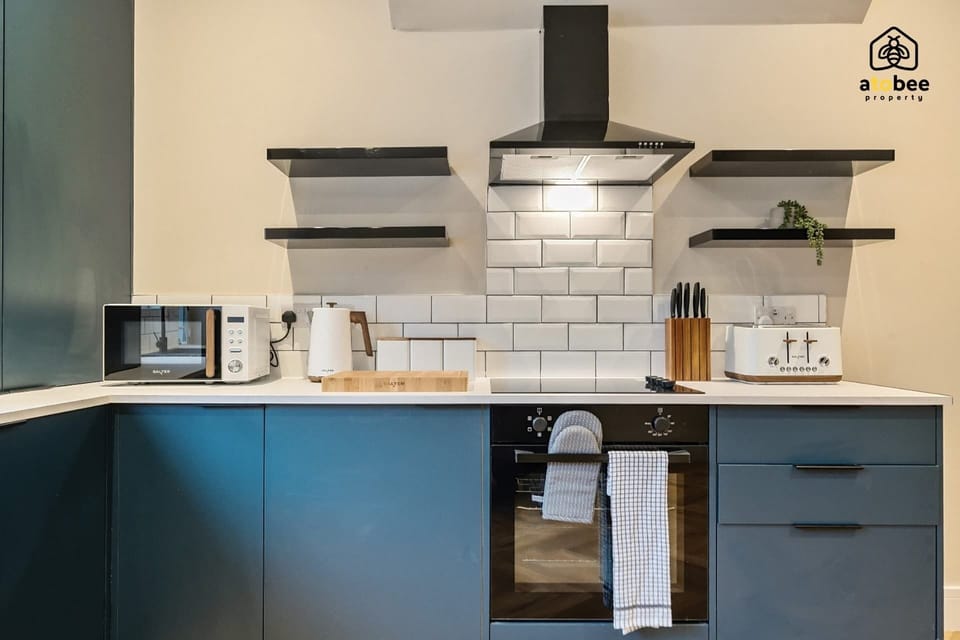 Enjoy the convenience of a well-designed kitchen that blends modern appliances with cozy charm.