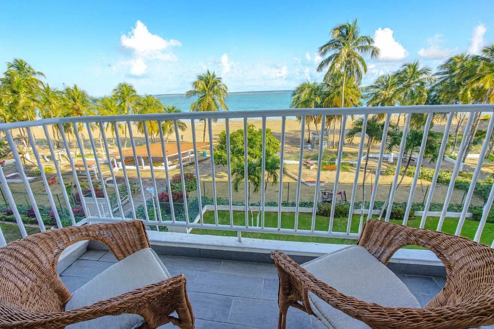 Enjoy stunning oceanfront views from your private balcony, surrounded by palm trees and fresh sea breeze. Perfect for sipping morning coffee or unwinding as the sun sets over Isla Verde Beach.