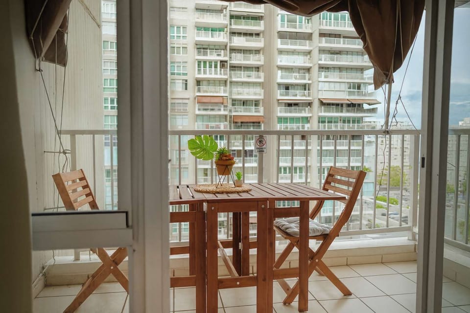 Private balcony with cozy outdoor dining for two — the perfect spot to enjoy your morning coffee.