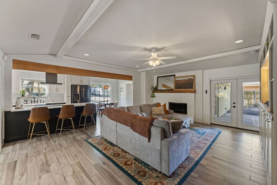 With contemporary decor and a classic fireplace, this living room is where comfort and style come together.
