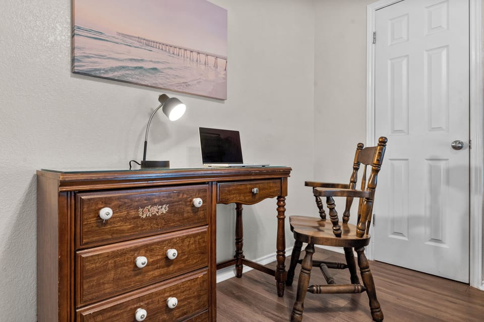 One of the bedrooms has a dedicated workspace.