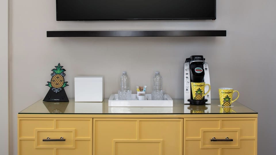 Sip morning coffee with an in-room brewer and snacks.