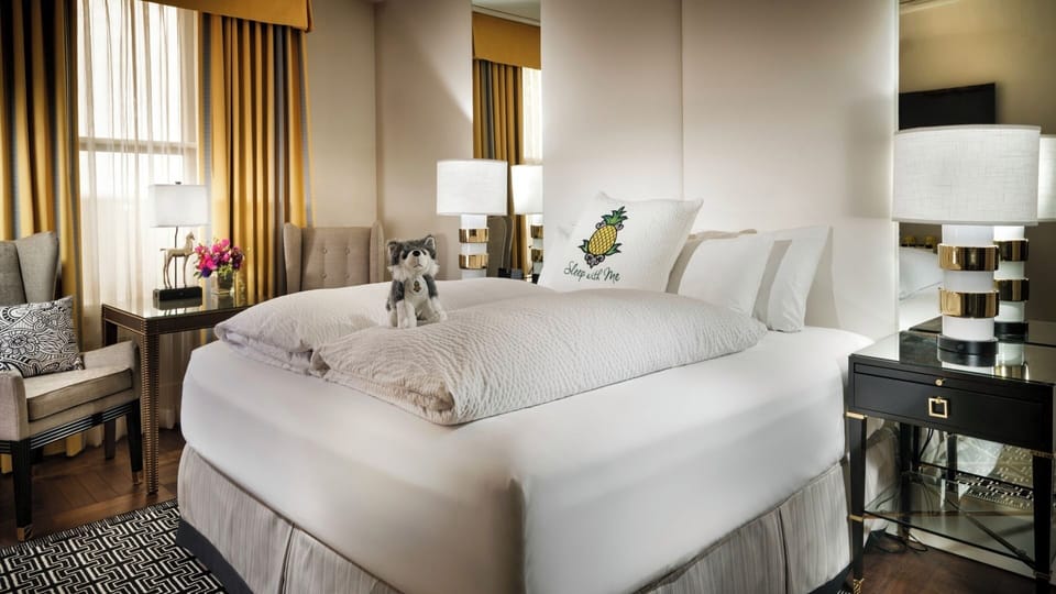 Sink into plush comfort beside glowing lamps and cozy seating.