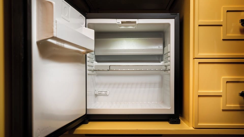 Stock cold drinks easily with a convenient in-room mini fridge.