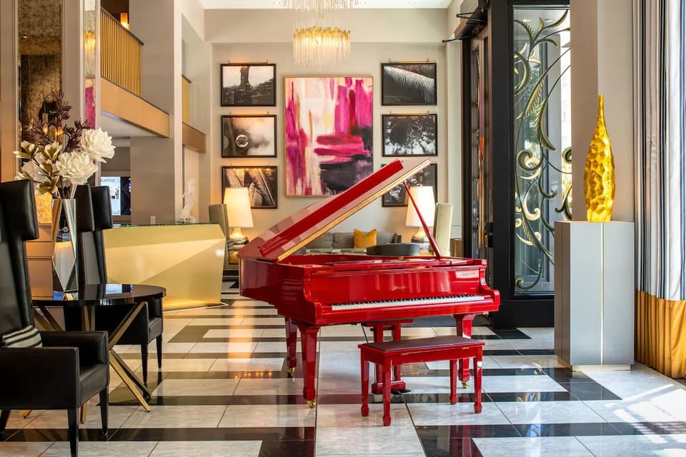 Play a grand piano beneath bright, art-filled hotel elegance.