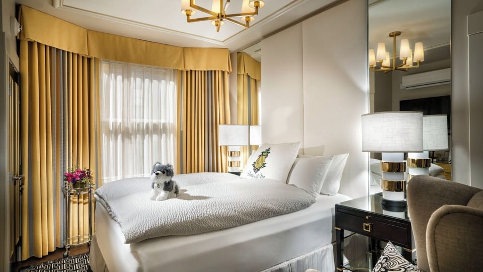 Wake refreshed in a bright, stylish room with warm drapery.