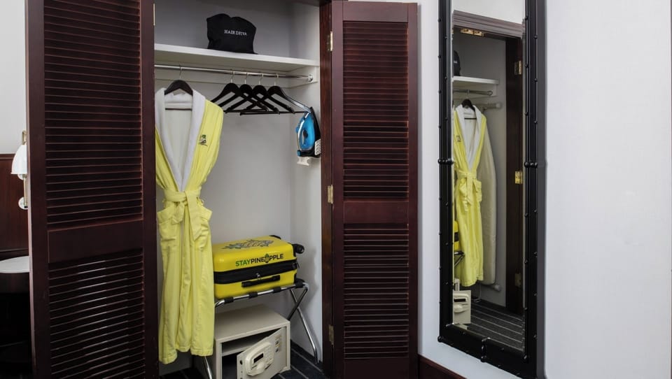 Organize effortlessly with hanging space, robe, and in-room safe.