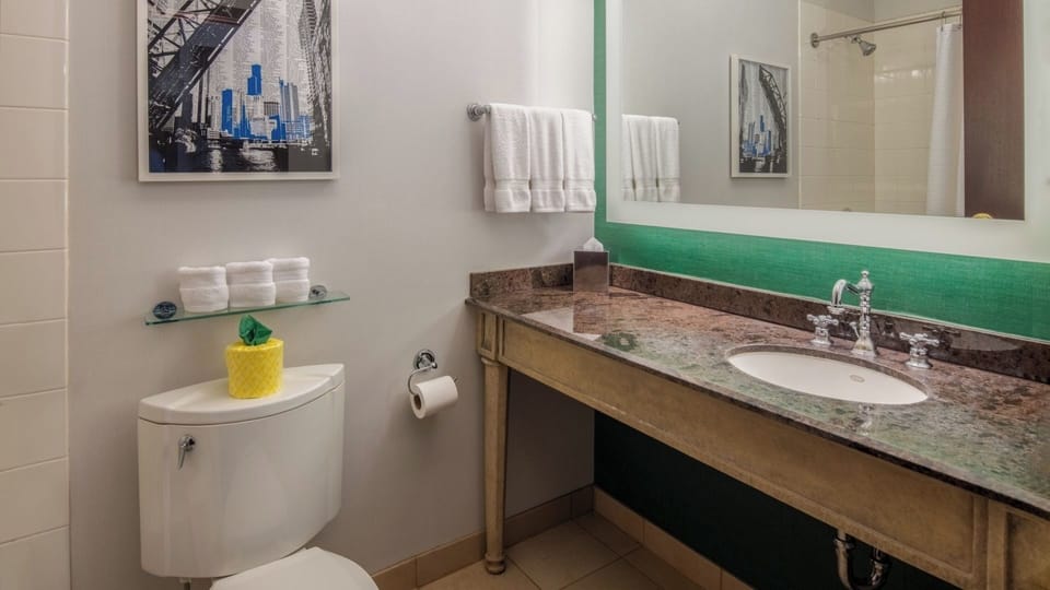 Refresh quickly with a bright vanity and fluffy towels.