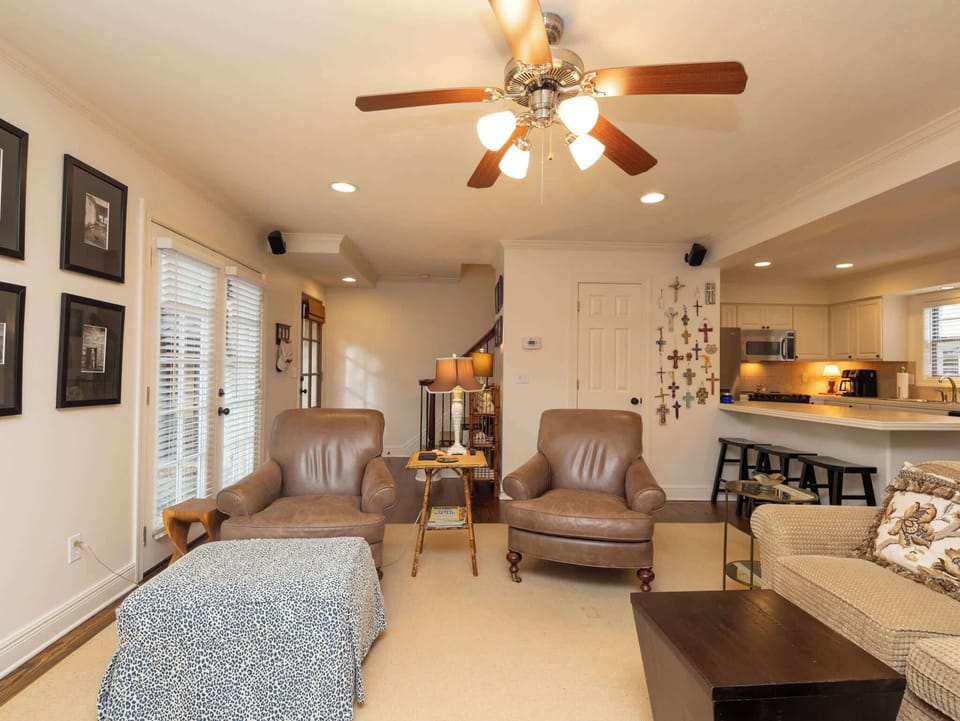 An alternative view of the living area showcasing the open layout and comfortable lounge seating perfect for group gatherings.