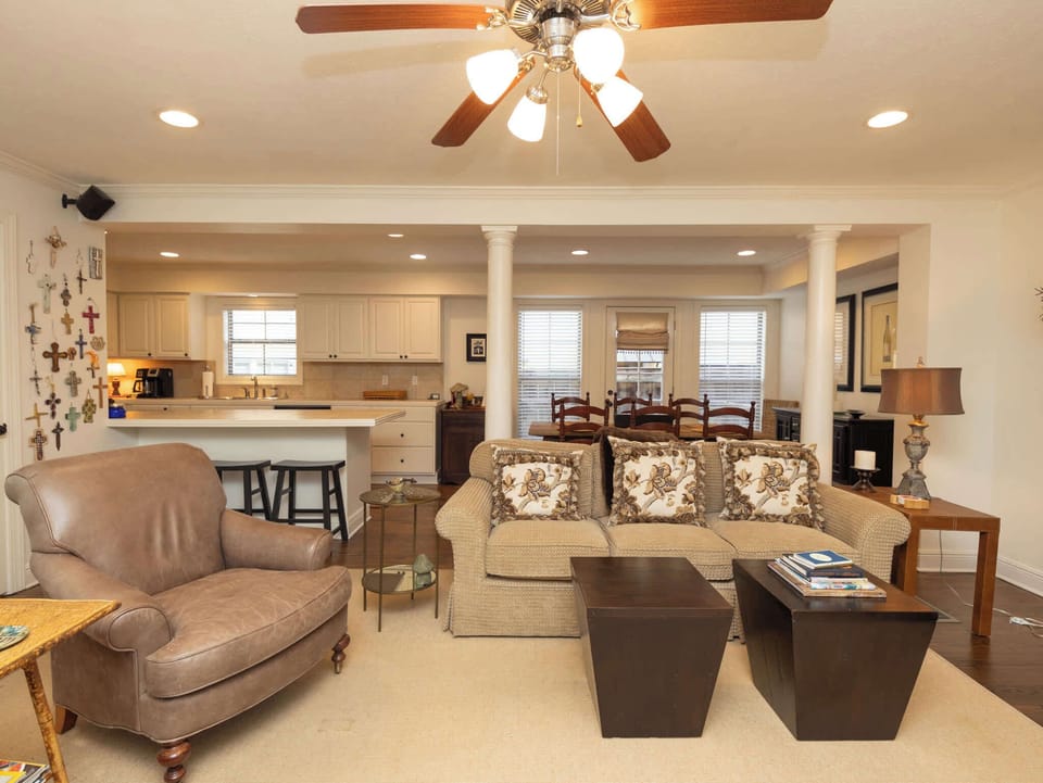 A wide perspective of the main social area, illustrating the spacious feel and integrated living and dining floor plan.