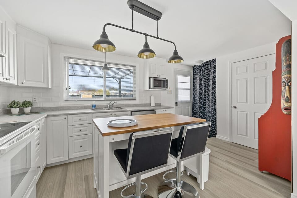6:30 PMClaude responded: Spacious kitchen island with butcher-block countertop, ample cabinet storage, and a sunlit window over the sink overlooking the backyard.Spacious kitchen island with butcher-block countertop, ample cabinet storage, and a sunli