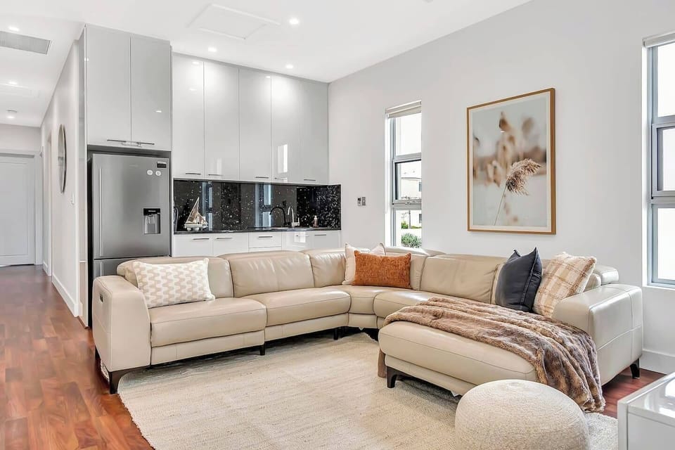 Upstairs, a secondary living area offers its own kitchenette, adding a touch of convenience to this versatile space.