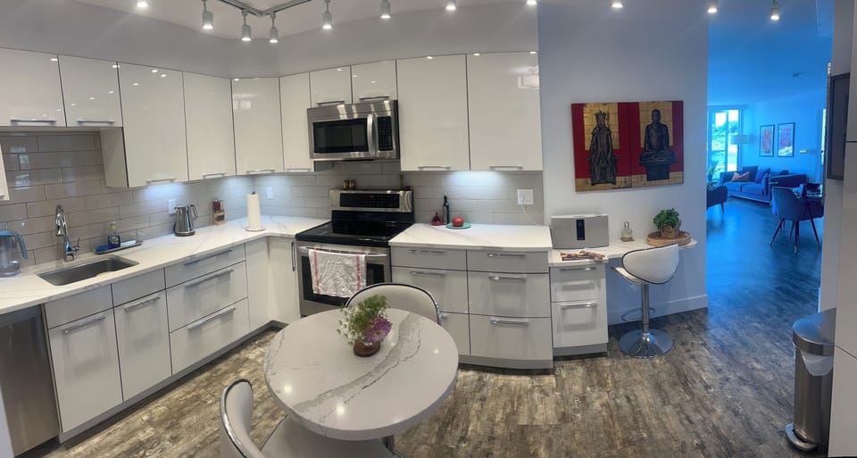 Large bright gourmet kitchen view to living room