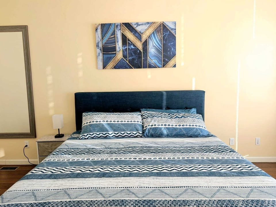 This king-sized bedroom offers the perfect retreat for relaxation and comfort.
