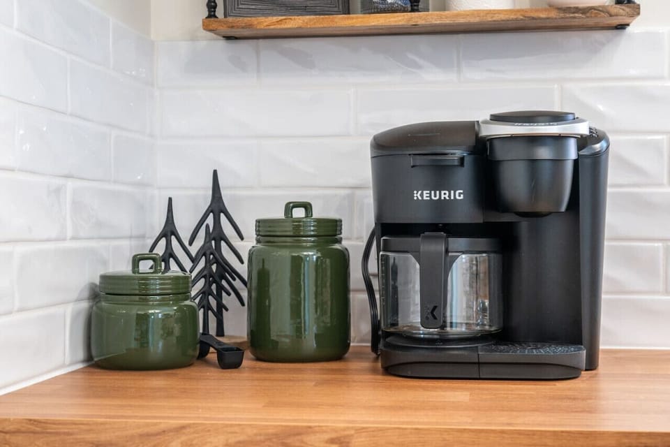 Full kitchen with a crockpot, kettle & a Keurig K-duo coffee machine.