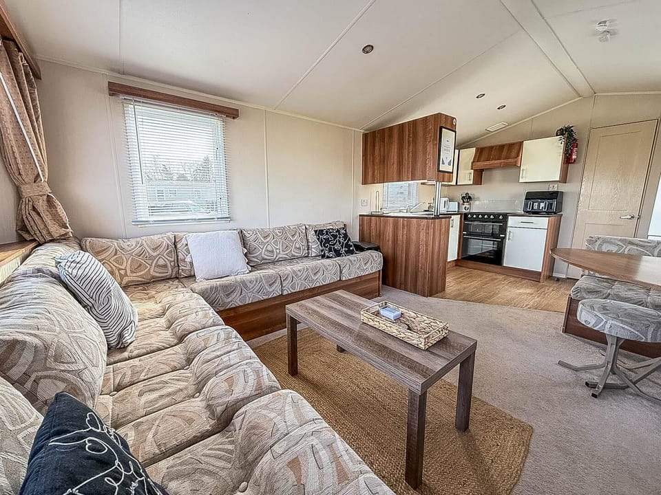 Relax in the living room of a caravan at Broadland Sands Holiday Park Lowestoft, the perfect retreat after a day exploring Lowestoft beach and Corton beach Lowestoft.