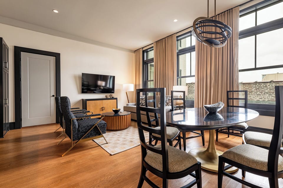 Bright and open living area with elegant furnishings and natural light, creating a welcoming and airy space.